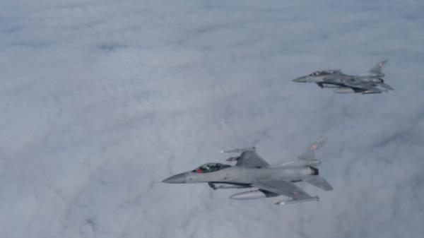 F-16 aircrafts fly during a NATO media event at an airba<em></em>se in Malbork, Poland, March 21, 2023. REUTERS/Lukasz Glowala