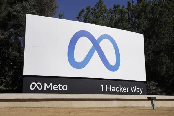 Facebook's me<em></em>ta logo sign is seen at the company headquarters in Menlo Park, California on October 28, 2021. 