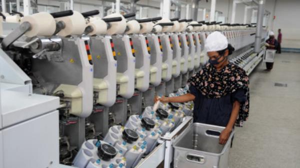 A woman working at Aman Spinning Mil. Photo: Courtesy