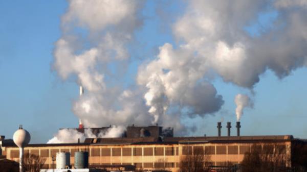 Smoke rises from chimneys at a factory in the port of Dunkirk, France January 19, 2023. REUTERS/Yves Herman/File photo

