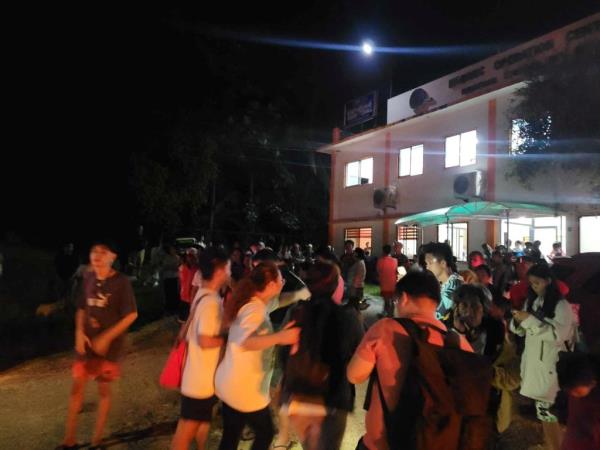 People gathered in the street after the earthquake in Hinatuan.