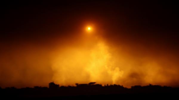 A flare falls over Gaza, amid the o<em></em>ngoing co<em></em>nflict between Israel and the Palestinian Islamist group Hamas, as seen from southern Israel, December 7, 2023. REUTERS
