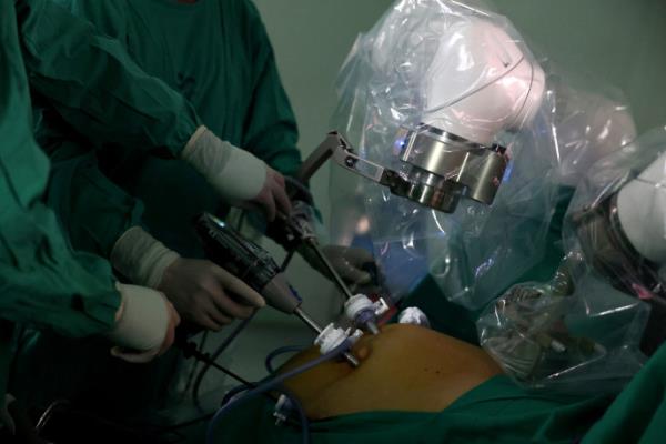 Surgeons use magnetic surgical robot arms, new technology instruments that work with magnetic fields, during an operation at a public hospital, in Santiago, Chile, December 4, 2023. REUTERS/Ivan Alvarado

